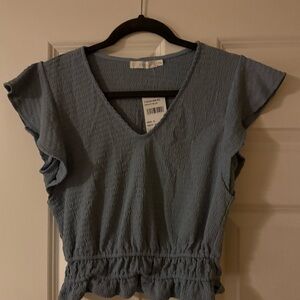 Lush Blue Flutter Sleeve Blouse with Ruffled Smocked Design